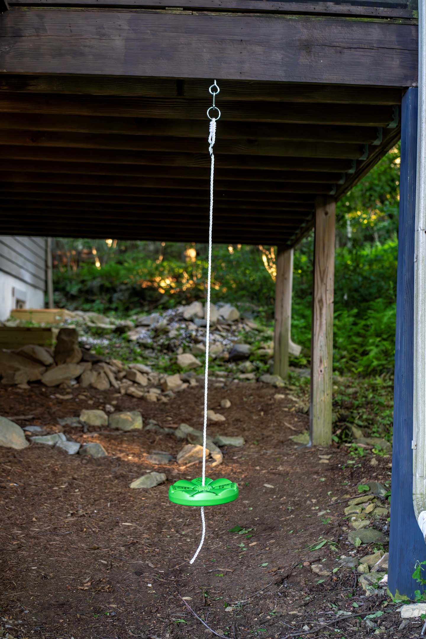 Simple disc swing under the porch—easy, classic fun for kids