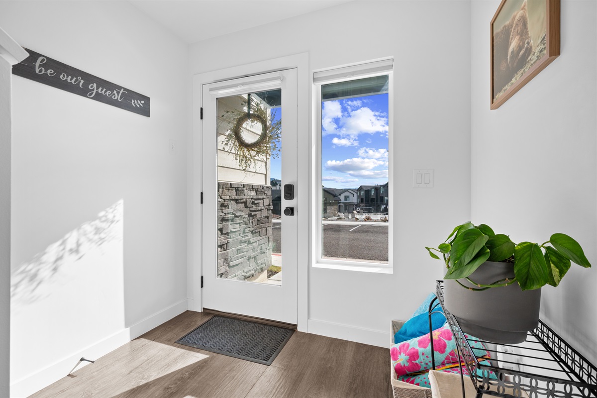 Private entrance with natural light and welcoming décor.