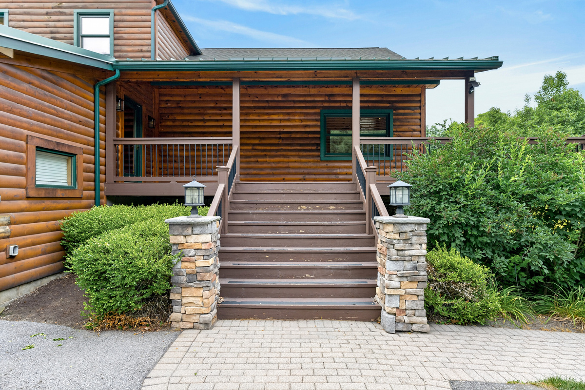 Covered entrance with wooden steps