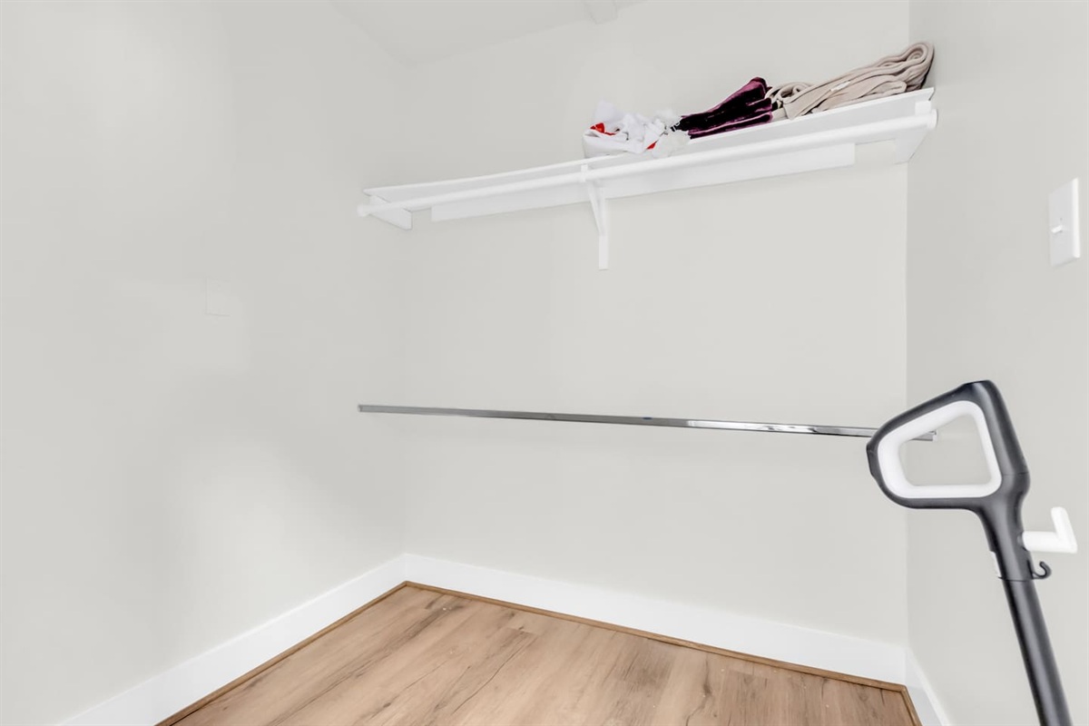 Walk-in closet with ample storage space.