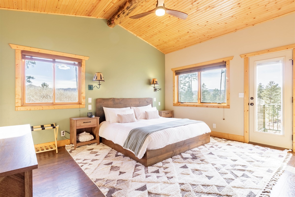 Indulge in serene luxury with our king size bed, framed by breathtaking wilderness views