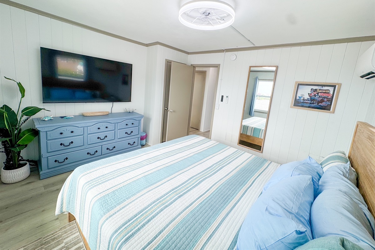Colorful Primary Bedroom w/65" TV
