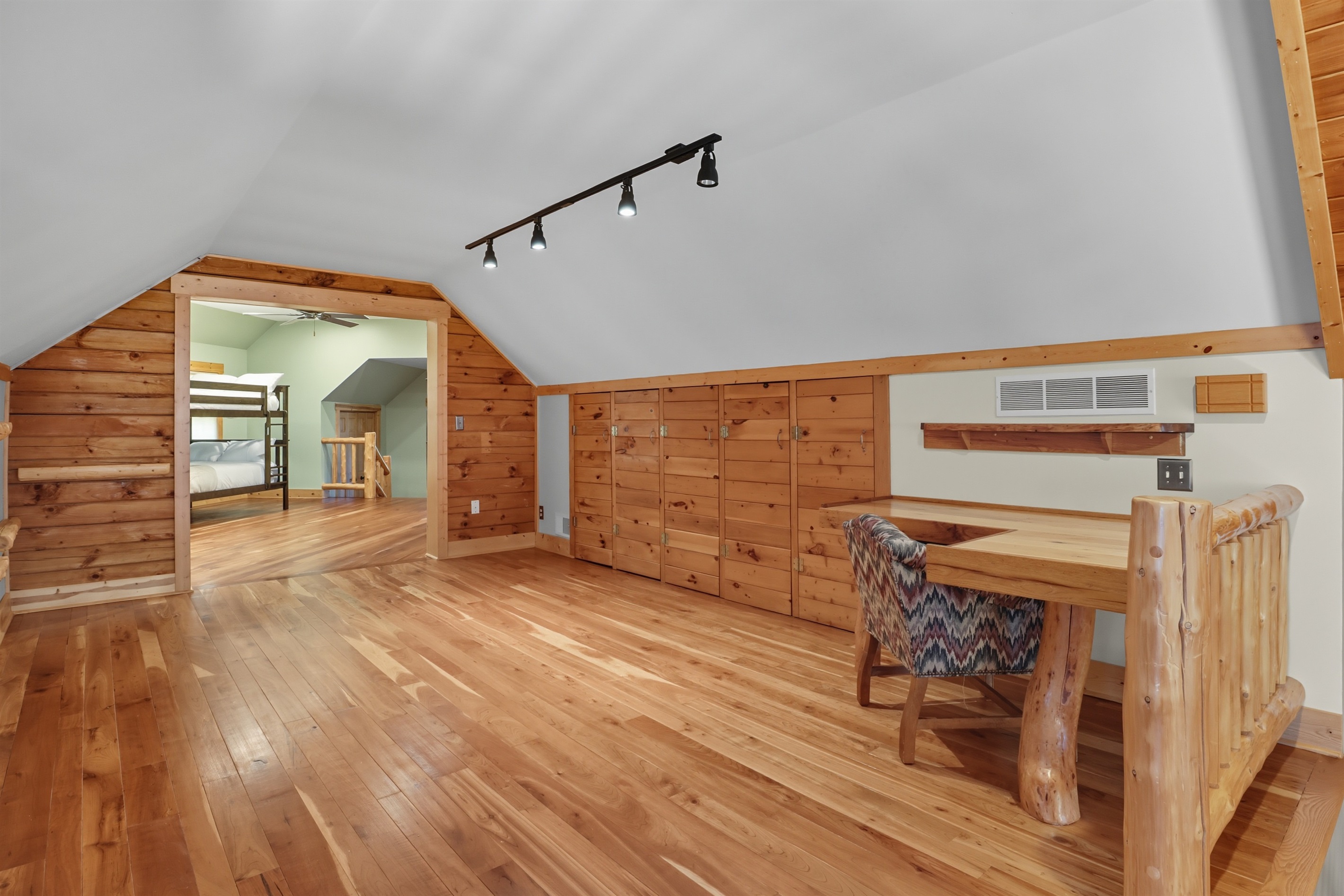Loft stairway with custom wood finishes.