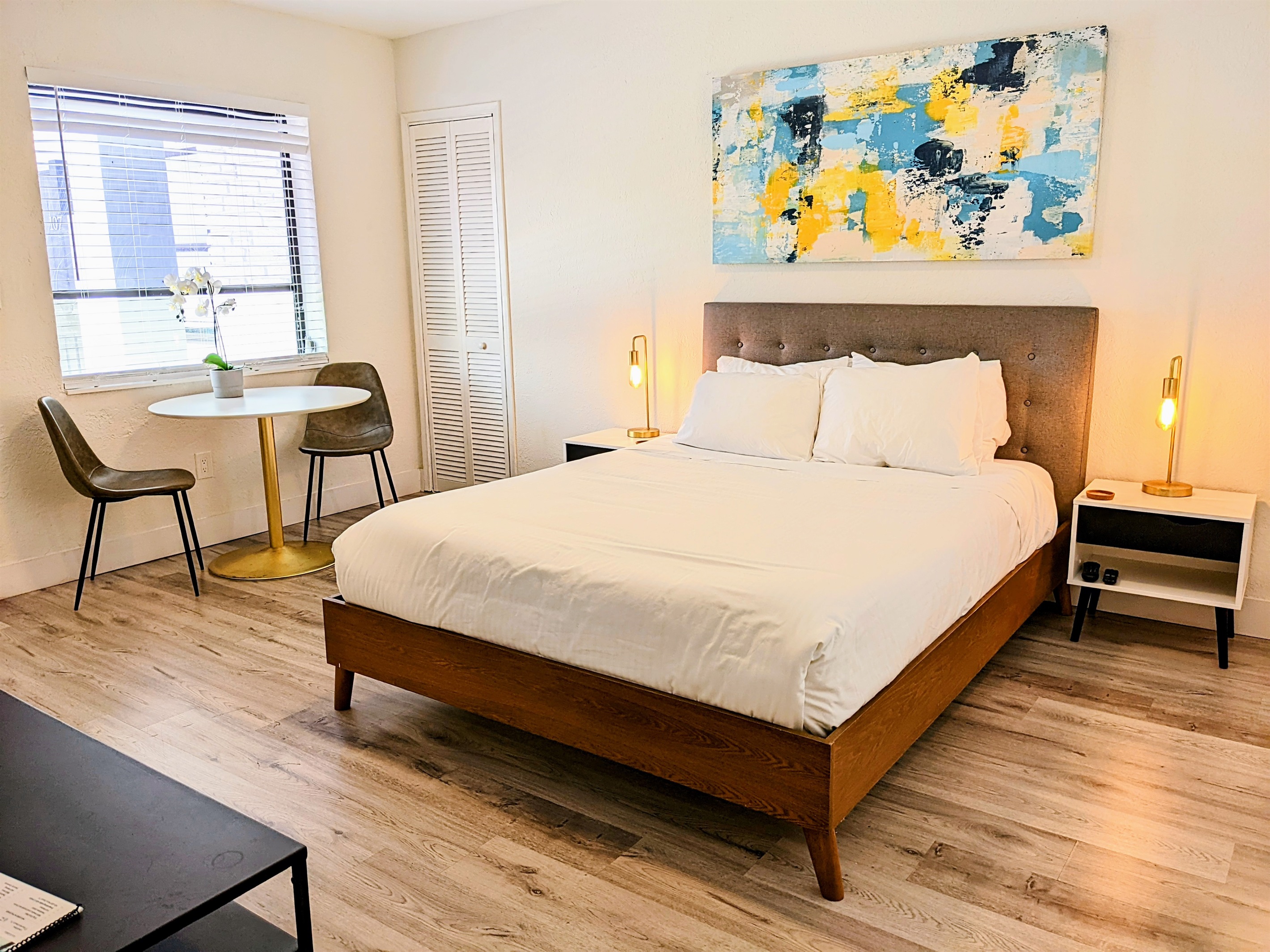Your studio has a pool view and a dining table for two.