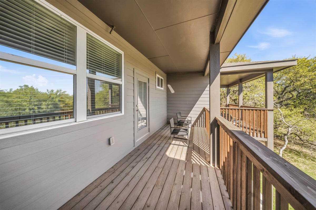 Upstairs balcony with seating for morning coffee