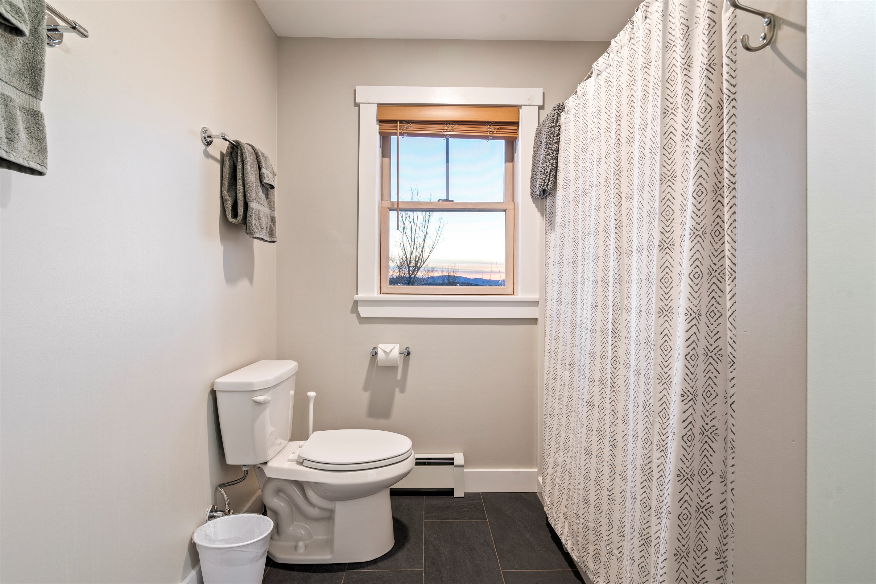 Convenient second-floor bathroom with standing shower and toilet