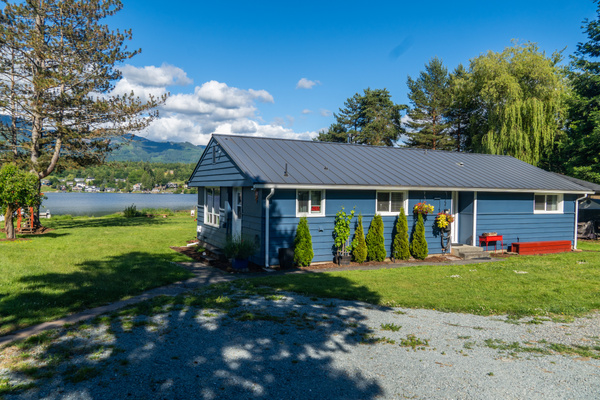 Tucked among the trees, this charming lake home offers a peaceful retreat just steps from the water. With ample parking, easy access, and a welcoming entrance, it's the perfect home base for your Big Lake getaway.
