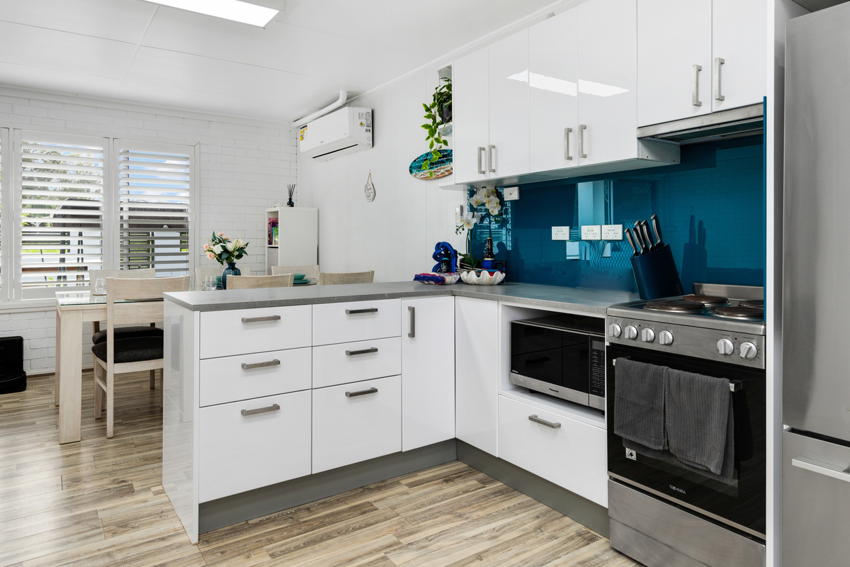 Two kitchens make Skye’s Beach House easier to use across both levels, with this downstairs kitchen adding a more self-contained feel.