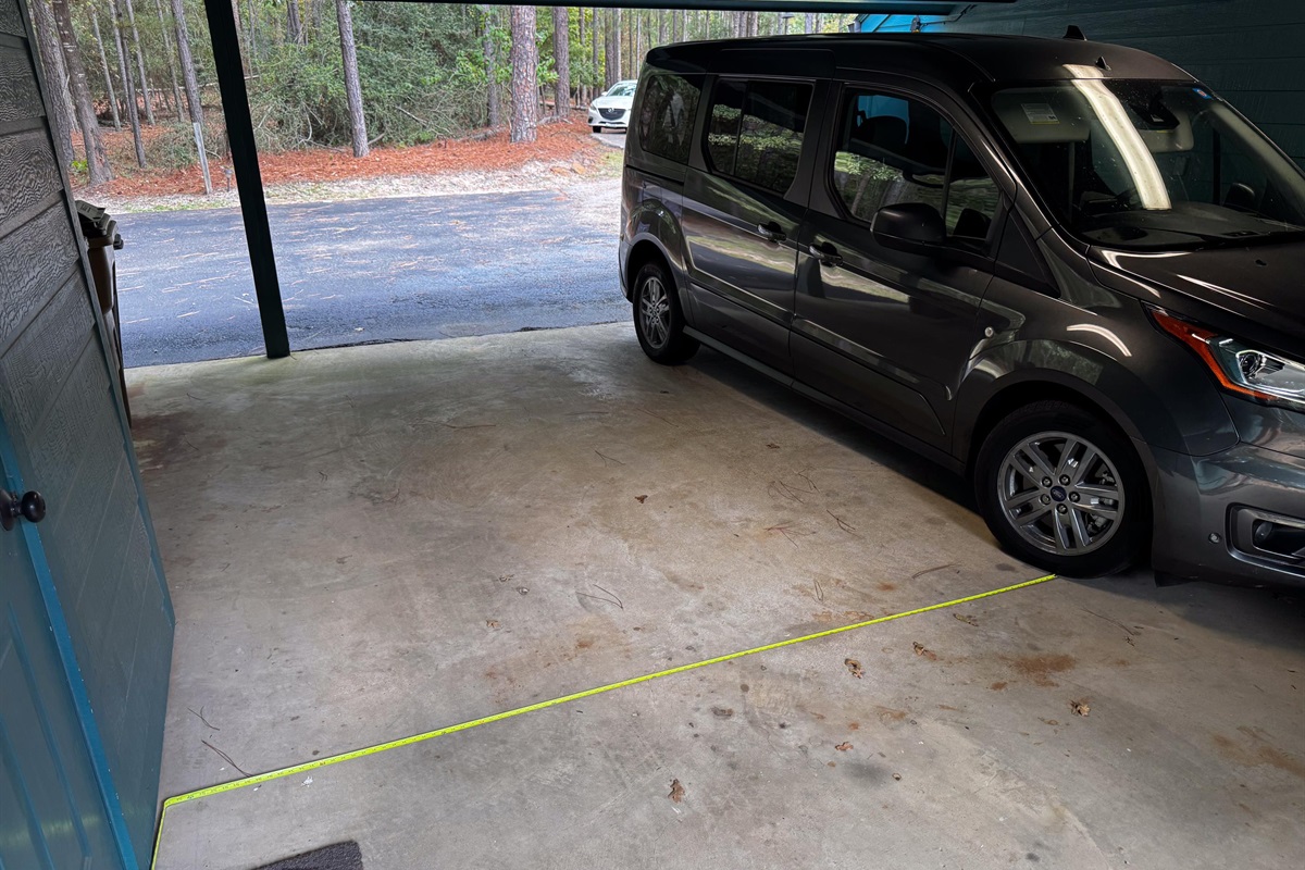2 vehicles can park in the carport.