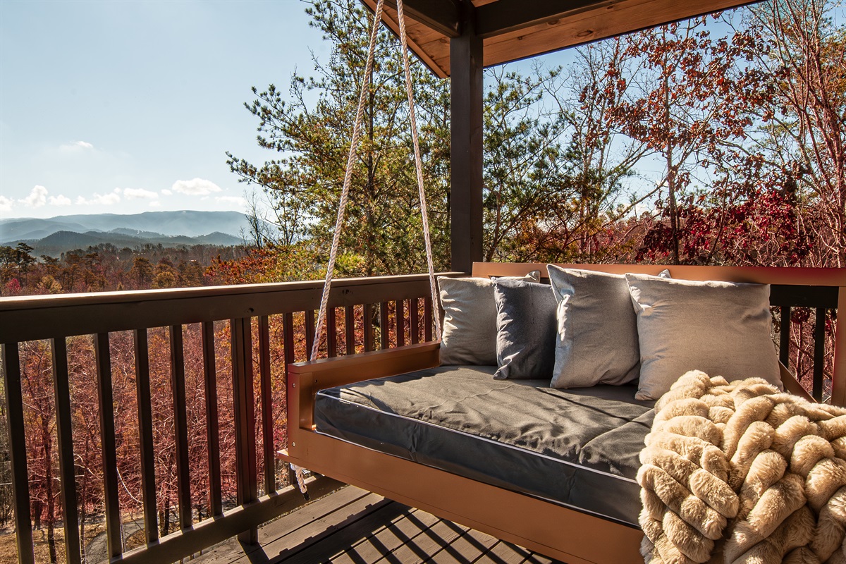 Fall asleep to a gentle breeze on our cozy outdoor bed swing.