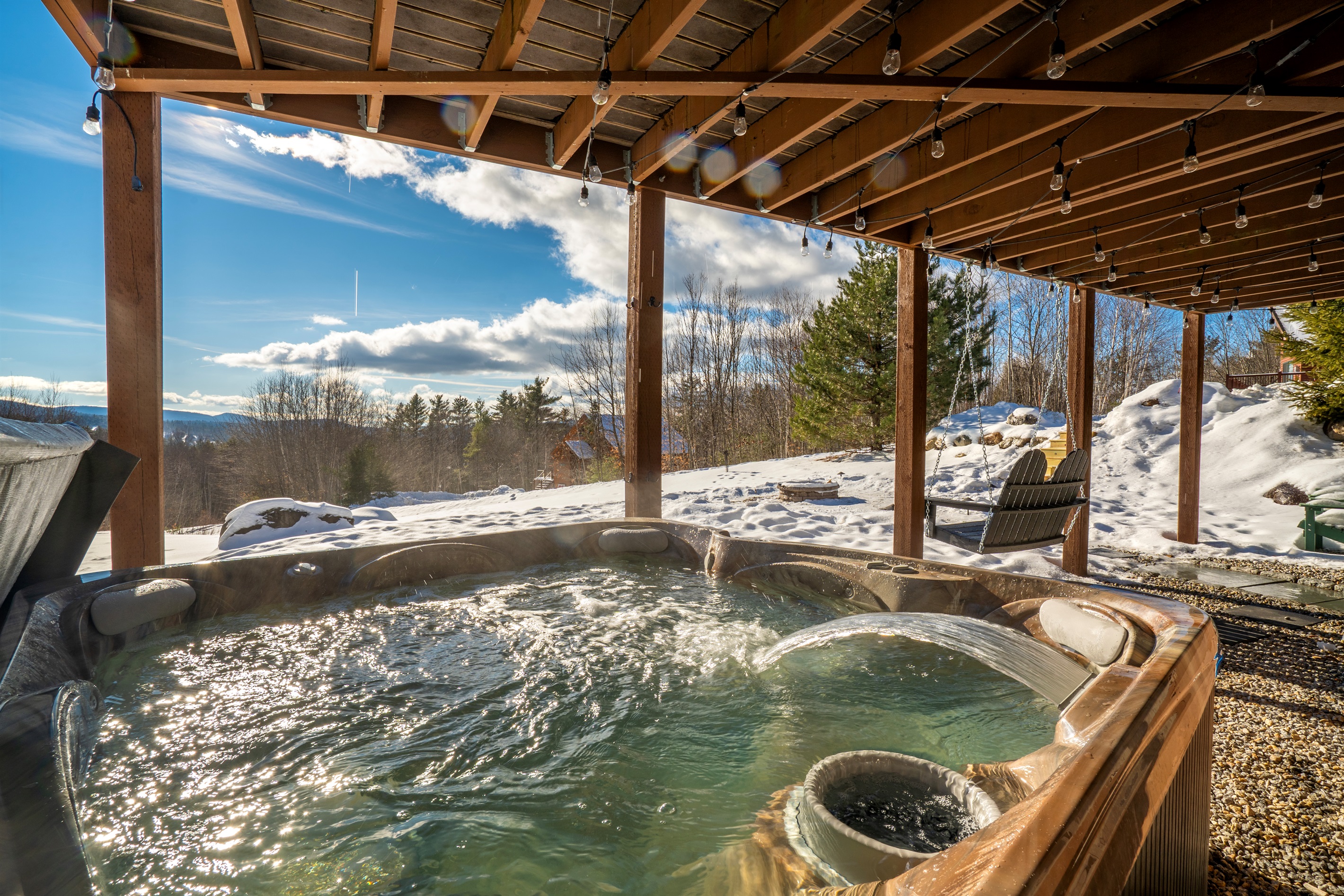 Daytime relaxation in the hot tub with panoramic mountain scenery