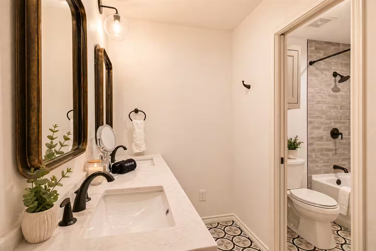 Modern bathroom with clean finishes and bathtub shower combo