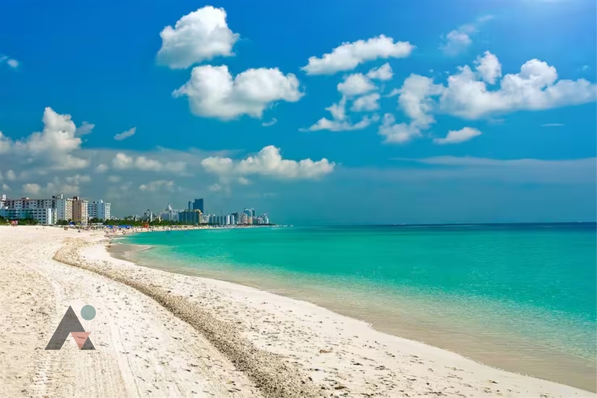 Castle Beach, just steps from the lobby, with wide, uncrowded sand and clear turquoise water right outside the building.