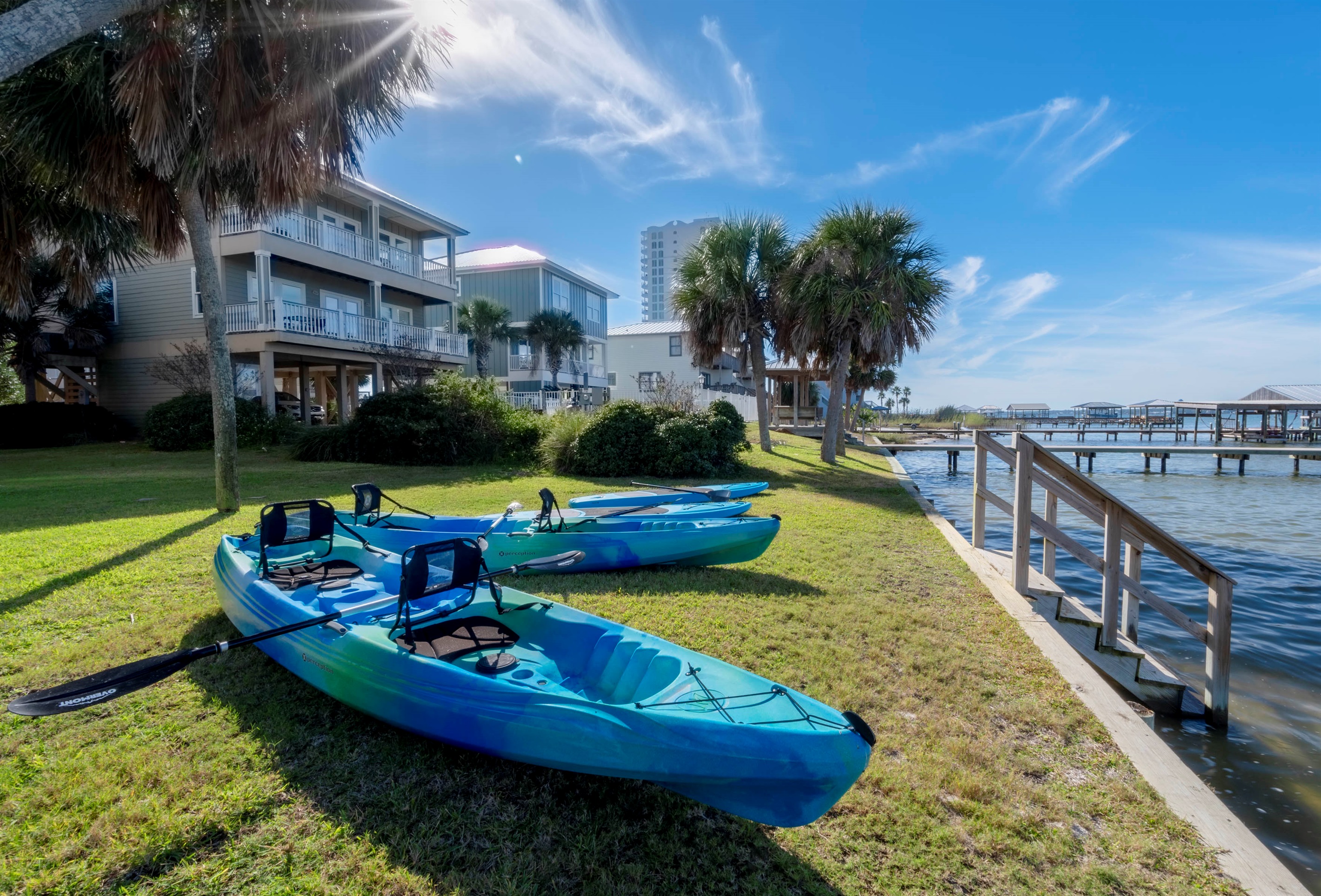 Kayaking adventures with serene views, calm waters, and blue skies by the waterfront escape.
