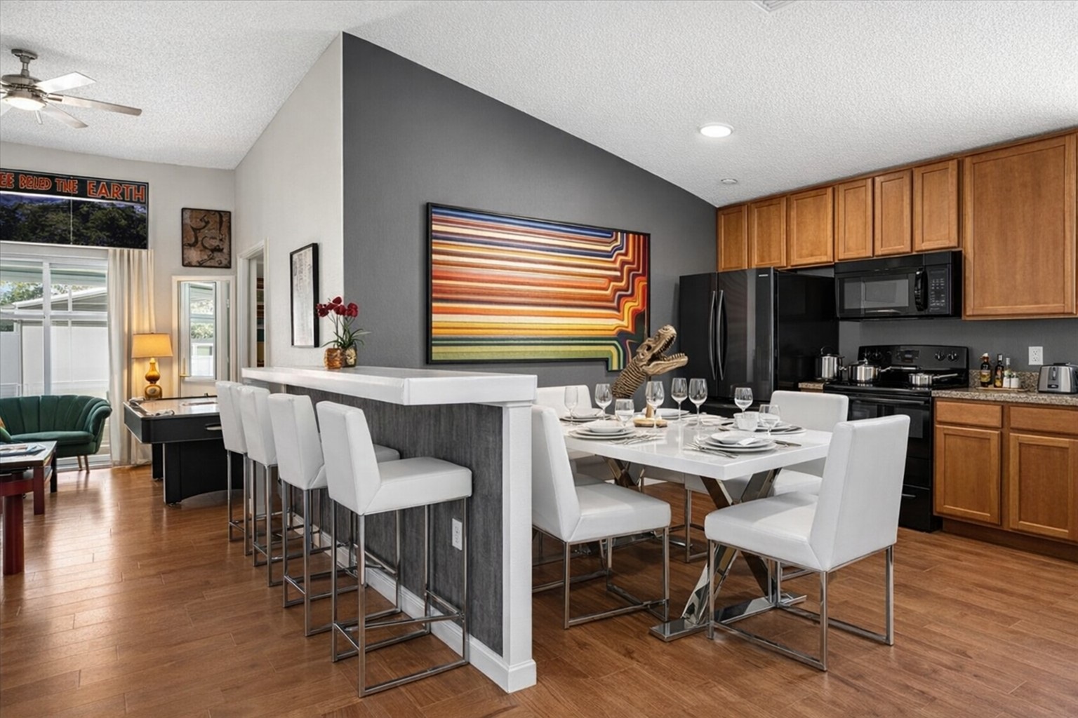 Modern kitchen and dining area with a large breakfast bar and seating for eleven