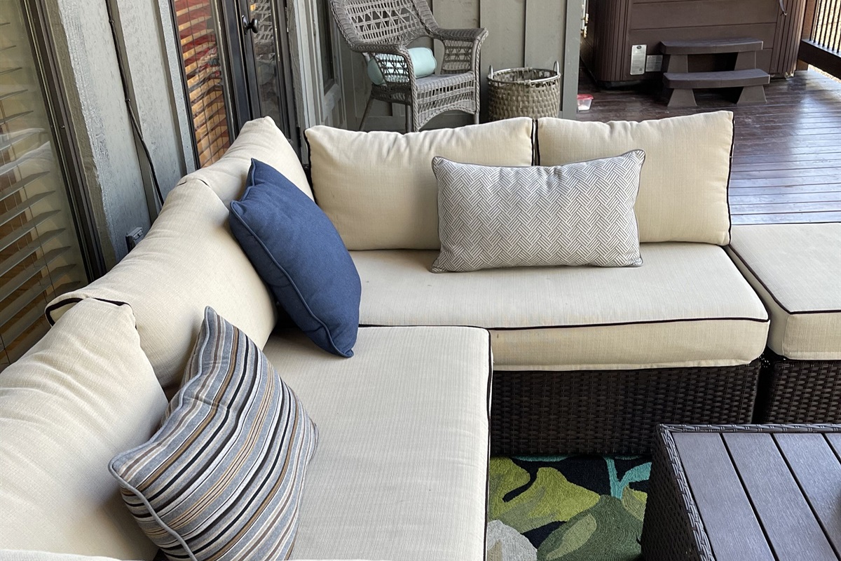 Comfortable outdoor seating for being a couch potato or enjoying the fireplace.