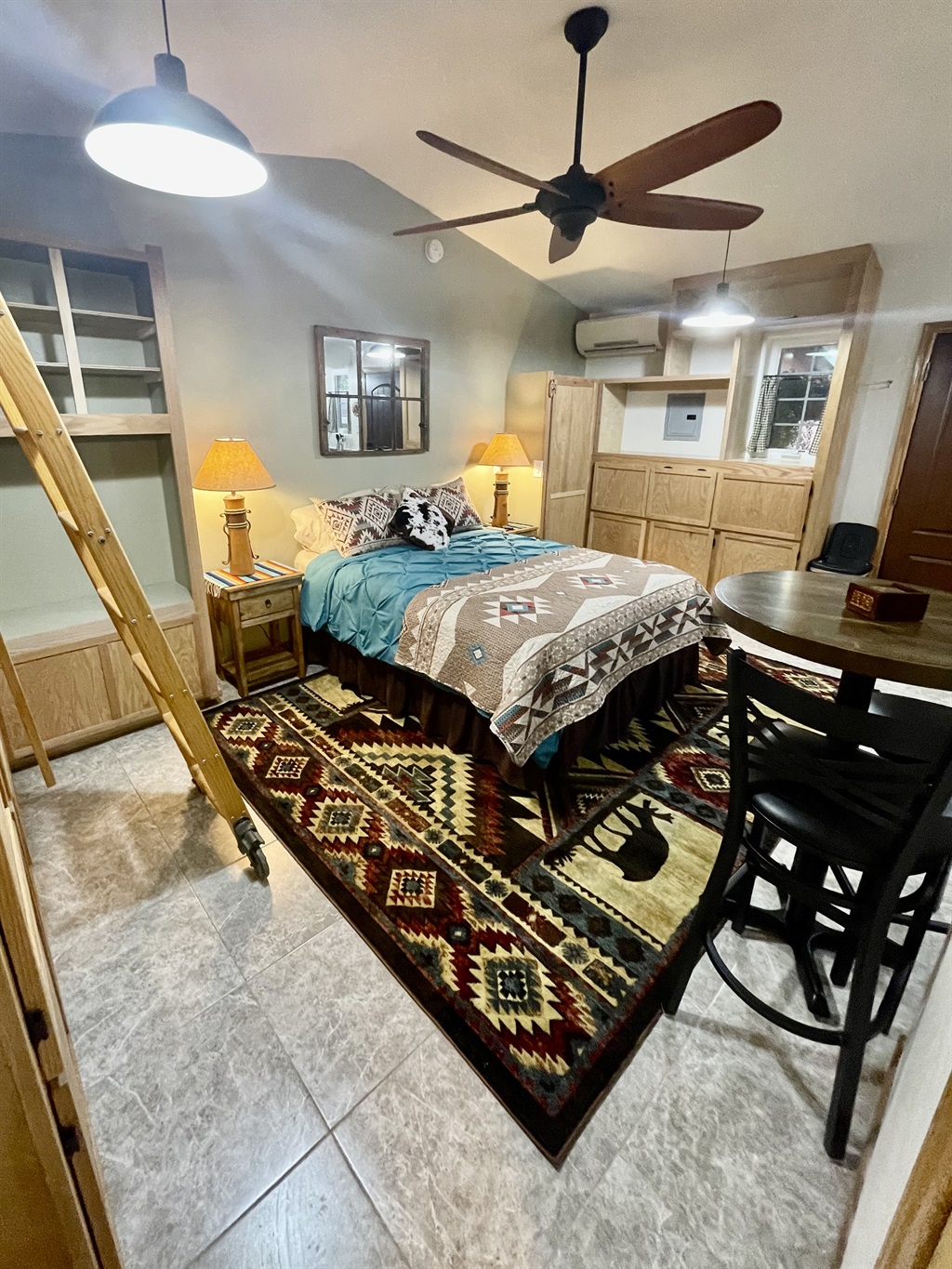 Wake up to garden views in this cozy queen bed with southwestern charm.