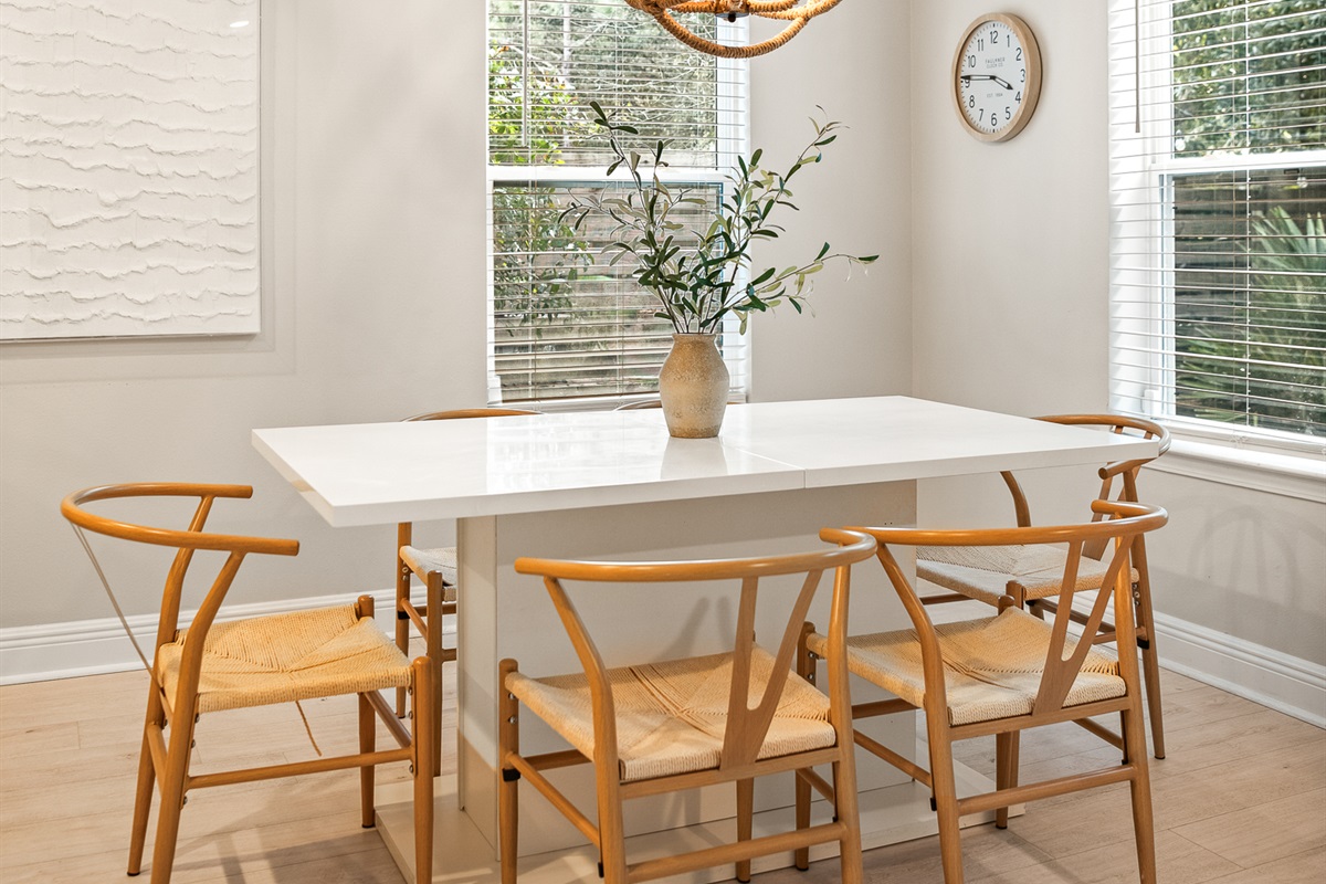 Dining: This bright, integrated dining space features a large table with an adjustable leaf, perfect for hosting family meals.