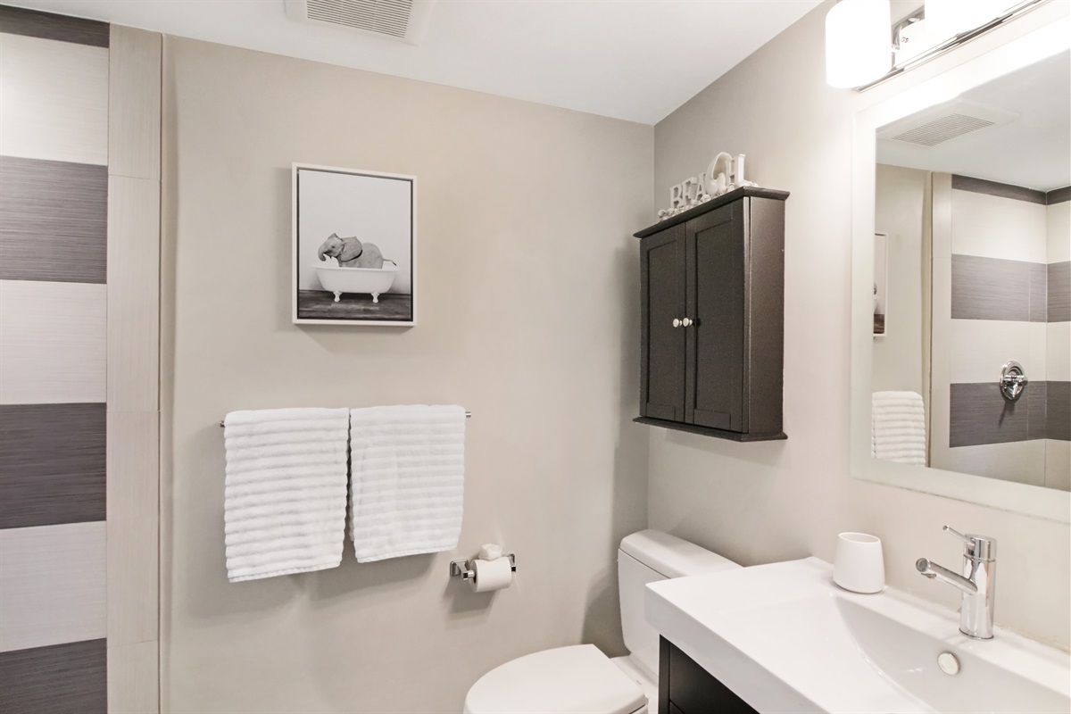 Tastefully designed bathroom with towels provided