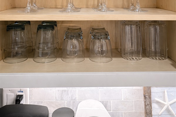 An array of both plastic and glass ware to enjoy your favorite beverage inside, on the patio or pool deck.