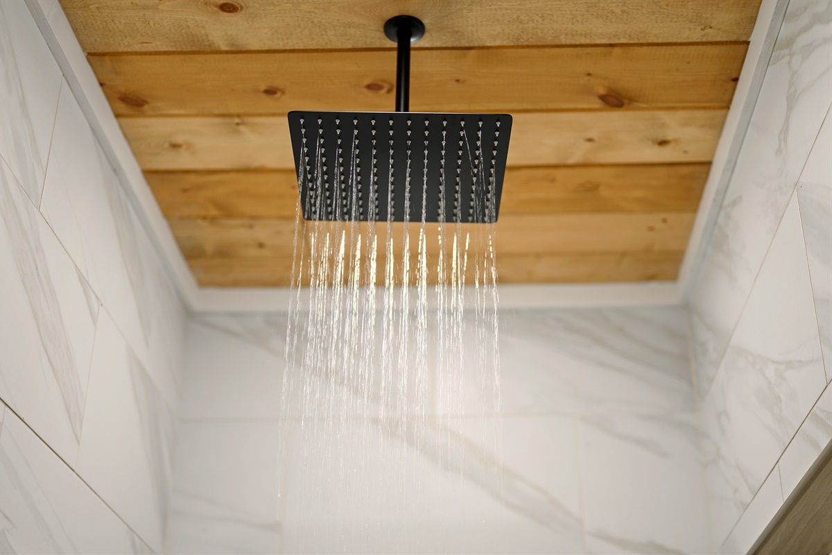Warm water overhead, peaceful cabin vibes all around, and the kind of slow start or slow ending your getaway deserves.