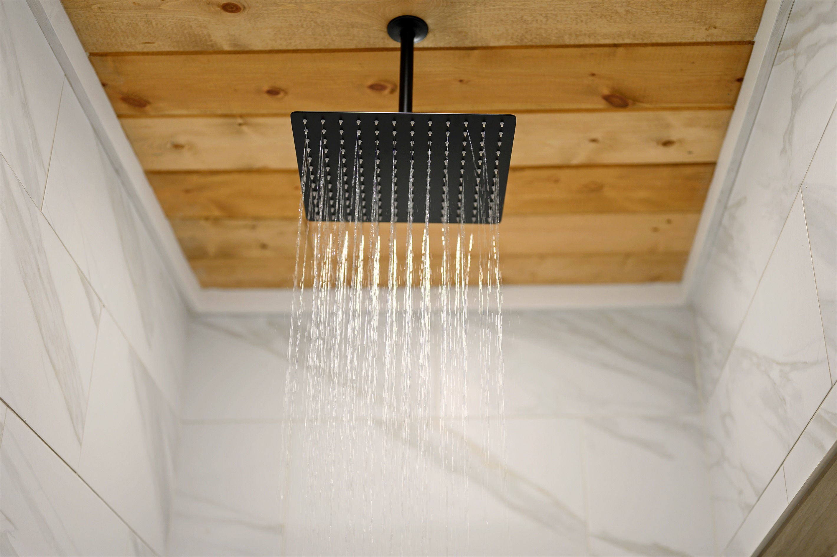 Warm water overhead, peaceful cabin vibes all around, and the kind of slow start or slow ending your getaway deserves.