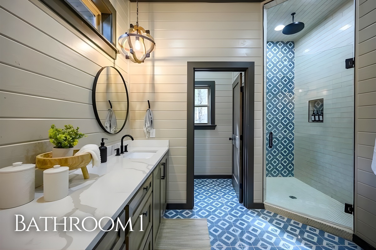 Featuring a spacious vanity and walk-in shower, the bathroom offers a spa-like atmosphere without ever leaving the cabin.