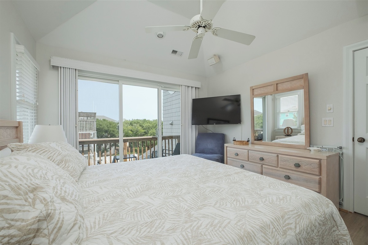 Relax in this 3rd Floor King Bedroom with a Smart TV and dresser.