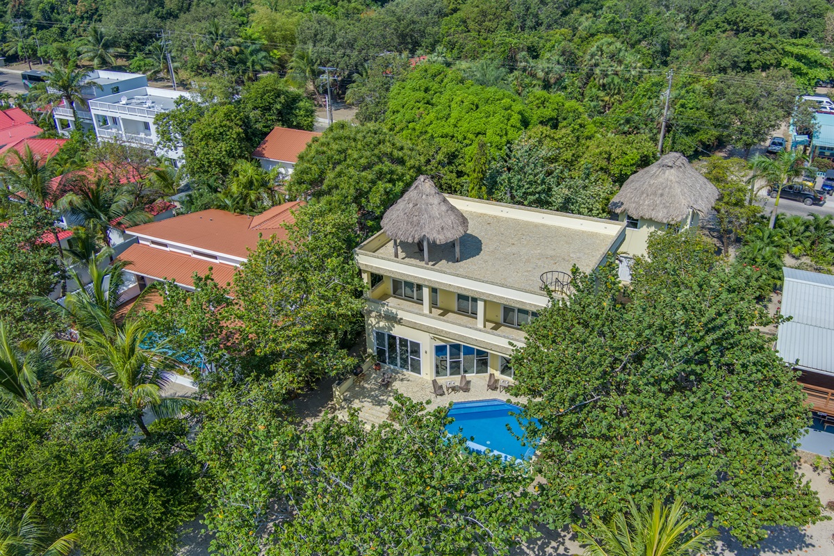 Birds eye view of villa, pool and palapa