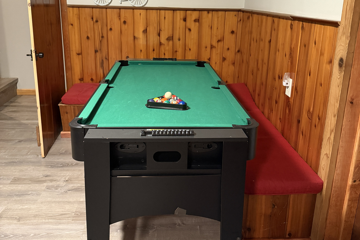 Lower level gameroom with mini pool table and SmartTV