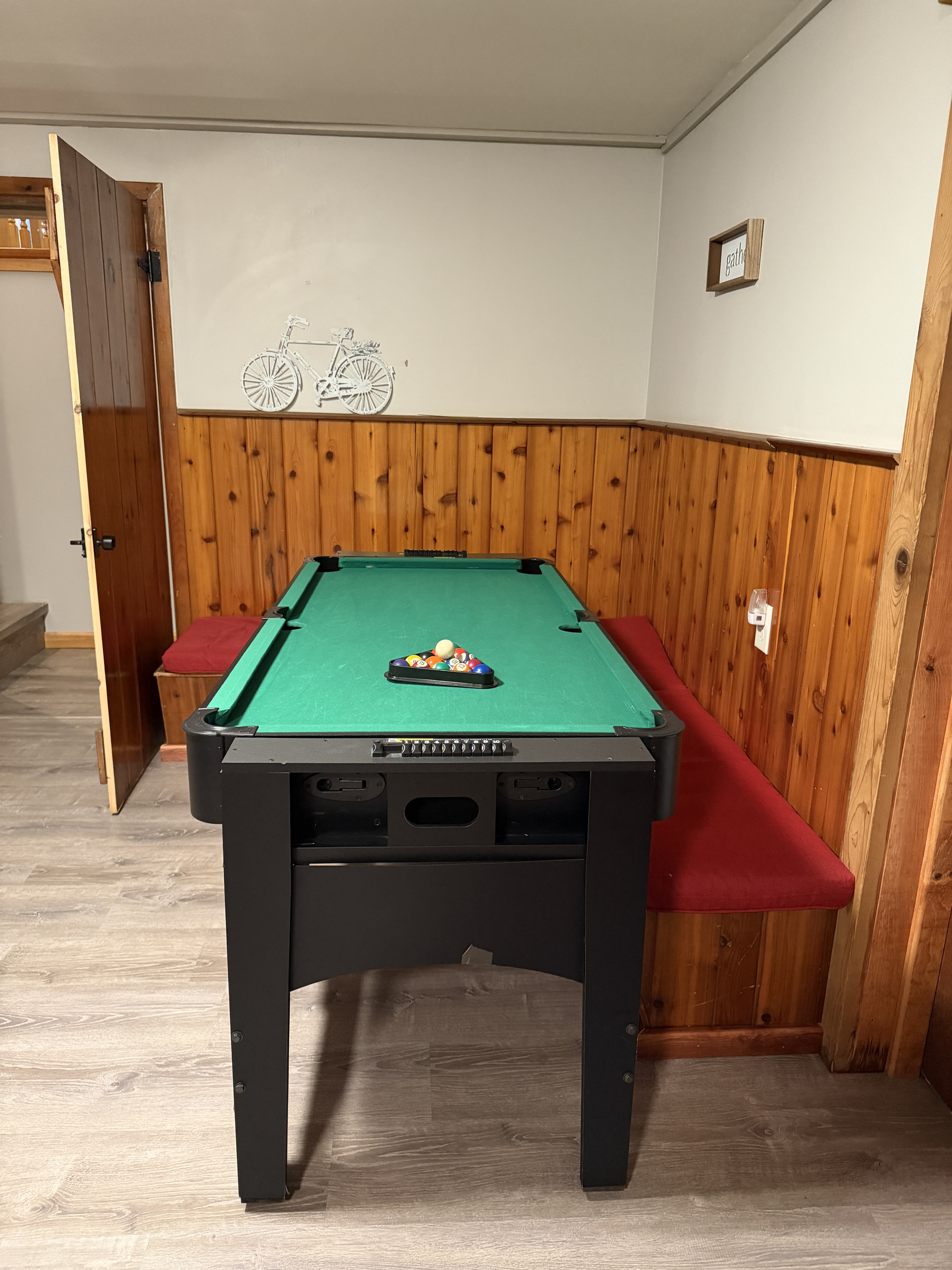 Lower level gameroom with mini pool table and SmartTV