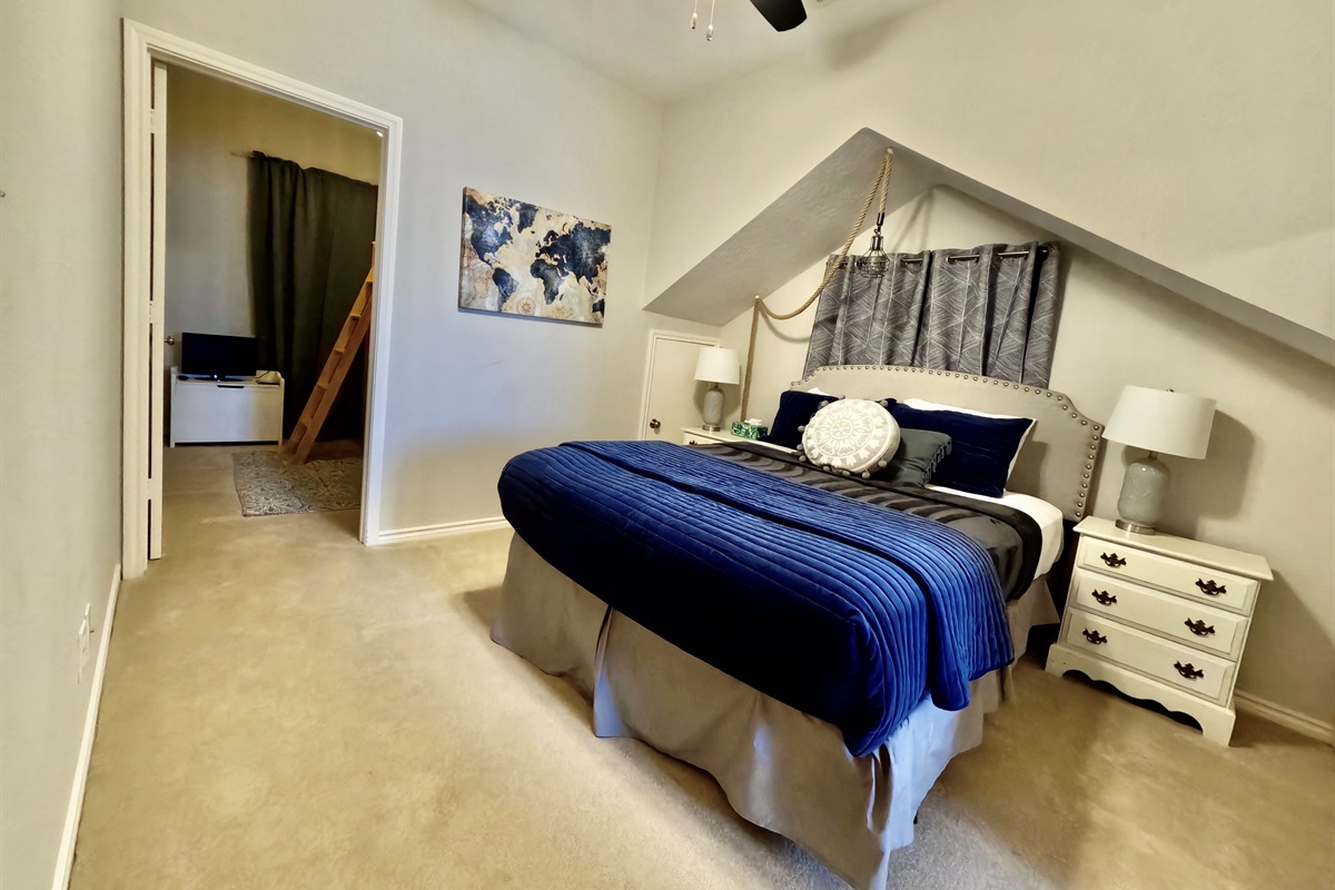 Queen bedroom on top floor with bunk bed nook and private restroom