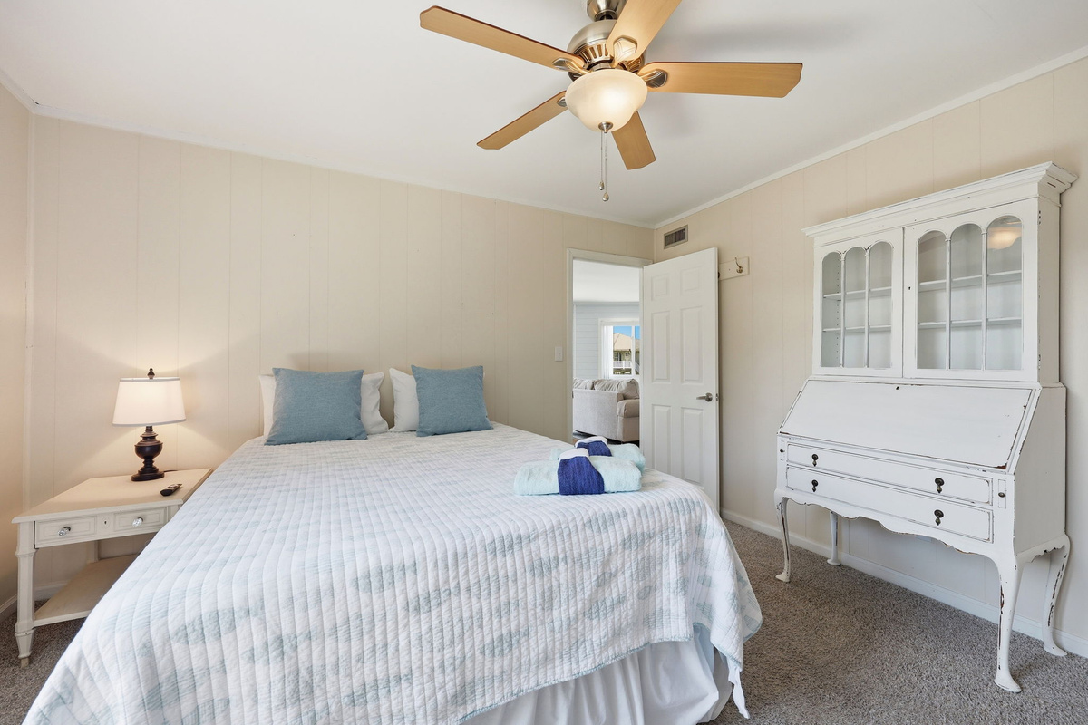 Rest easy in the spacious queen bedroom with deck access
