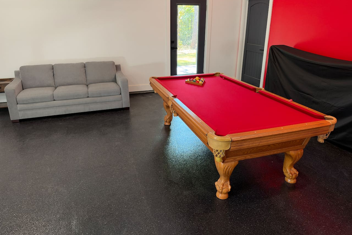 Pool table and queen sofa bed in converted/insulated garage.