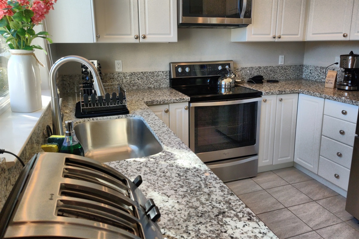 Full kitchen with dishwasher and French door refrigerator