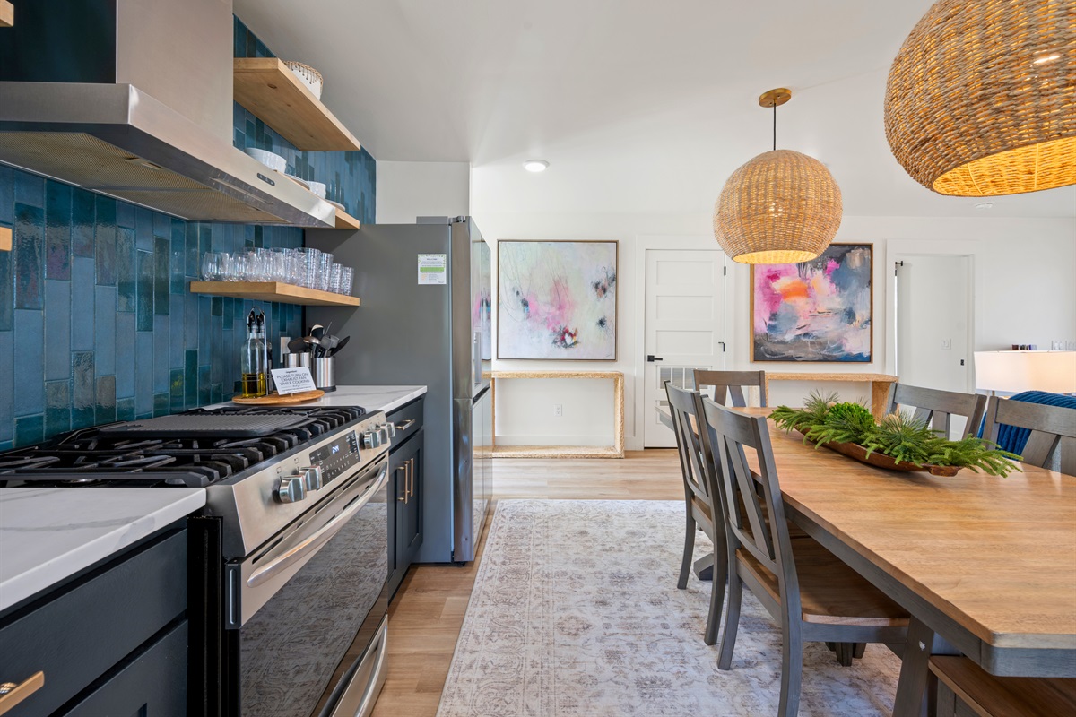 Sleek countertops and clean lines give the kitchen a polished, modern feel while still maintaining a warm and inviting atmosphere.