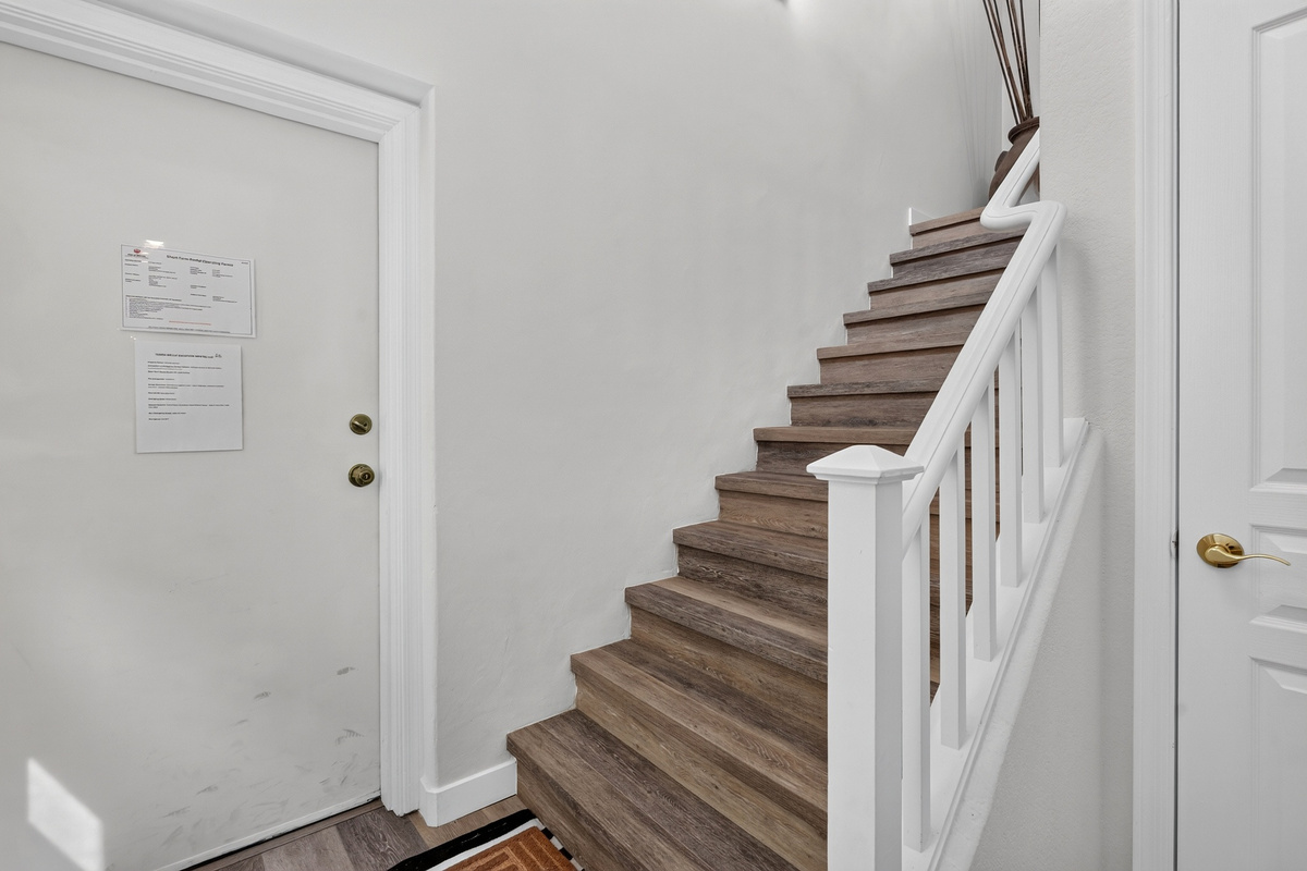 Stairway entry with interior access and a simple layout connecting to the upstairs rooms.