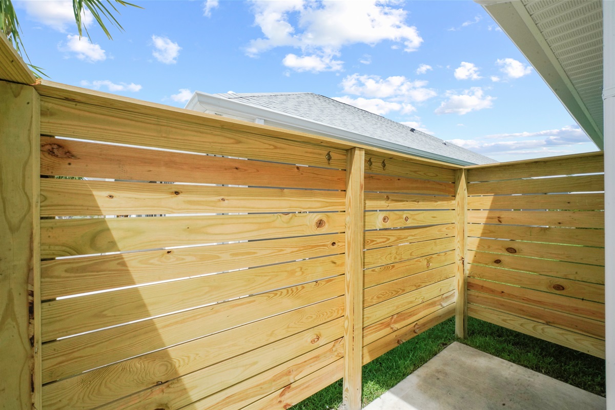 Outdoor shower available to rinse off sand before heading inside.
