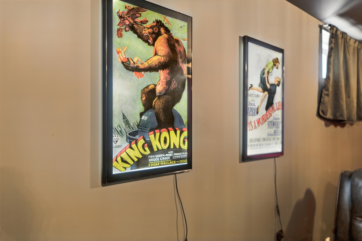 Movie posters, themed lighting, and comfy seating set the tone