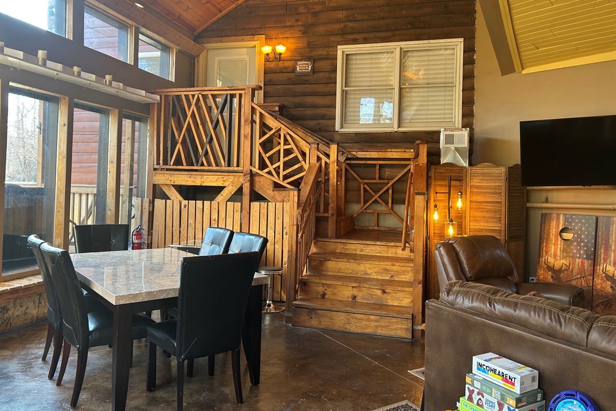 This climate controlled area is a nice gathering place between the Log Cabin and Guest Quarters. The entrance to the Log Cabin is at the top of the stairs.