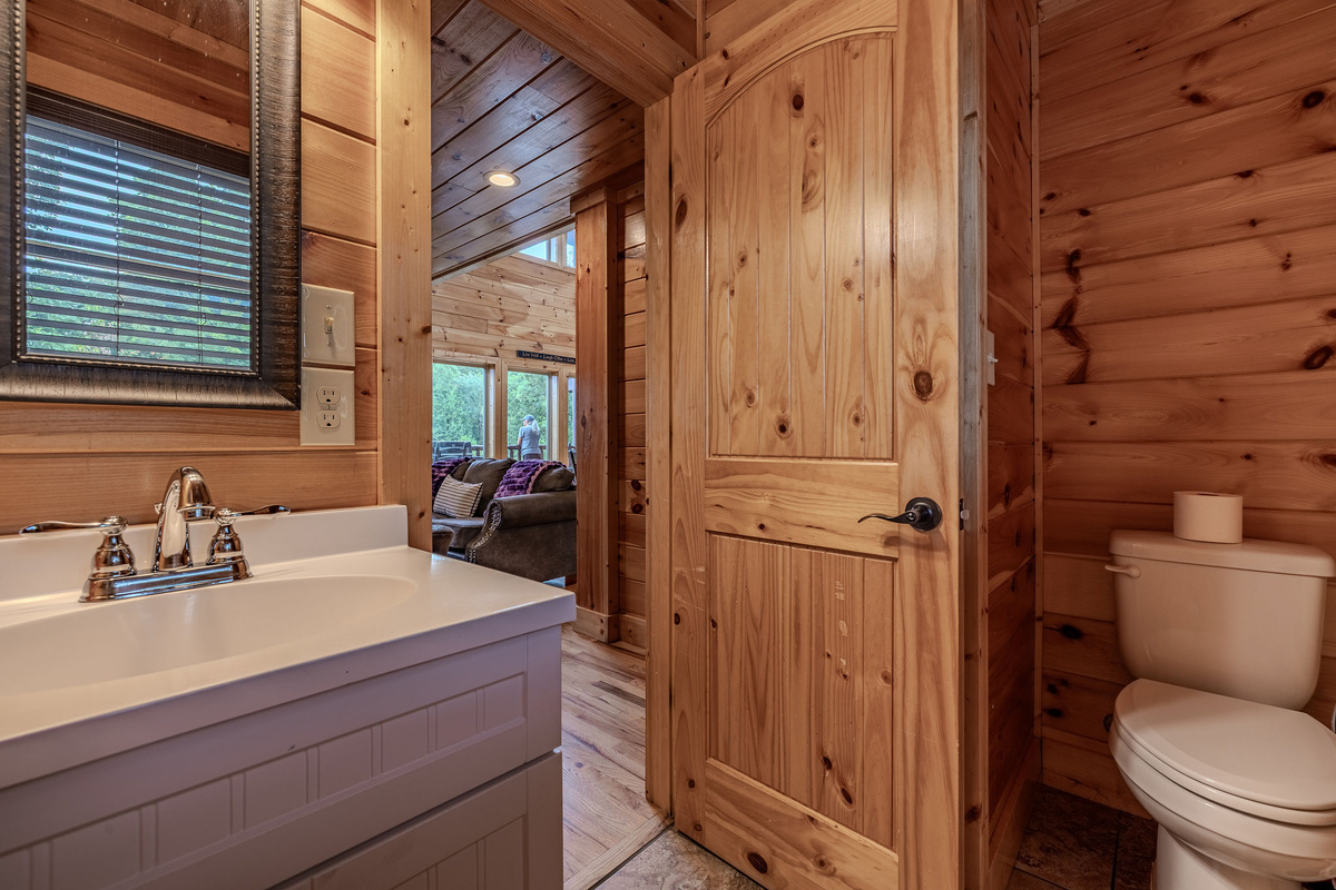 A convenient main-level powder room is located near The Grand Lounge, Supper Club, kitchen, and deck access.