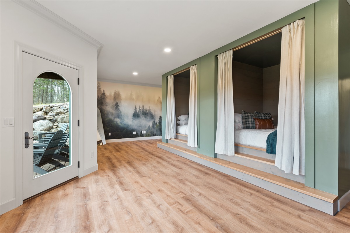 Going downstairs, we start with a shared room with 2 private king beds.