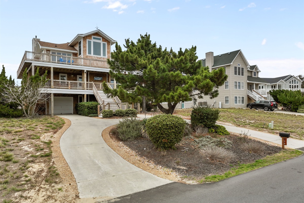 Driveway view as you arrive—tucked in with a bit of privacy.
