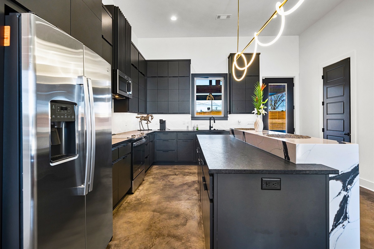 This beautifully designed kitchen offers the best of modern style and functionality, with expansive counter space and a layout that flows effortlessly into the home.