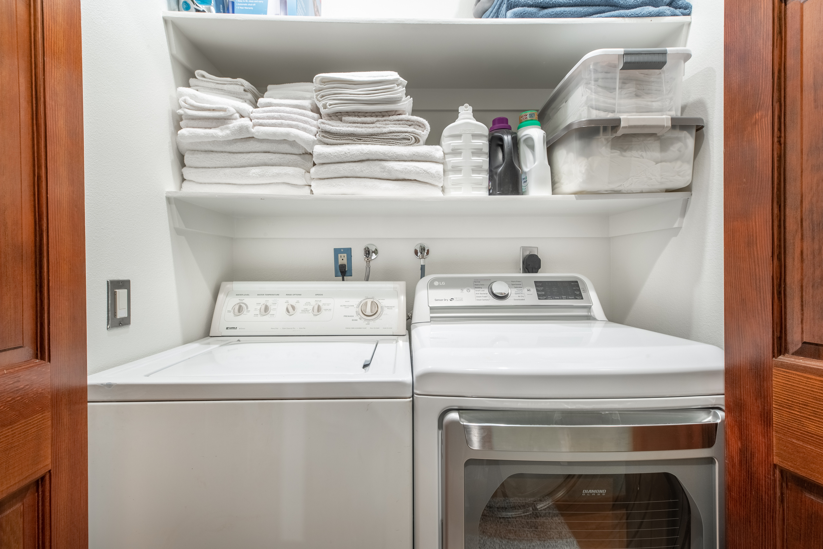 Convenient laundry area with full-size appliances