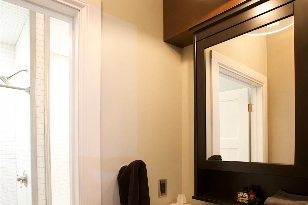 Close the historic original door door between the sink area and the shower/bathtub/commode for privacy