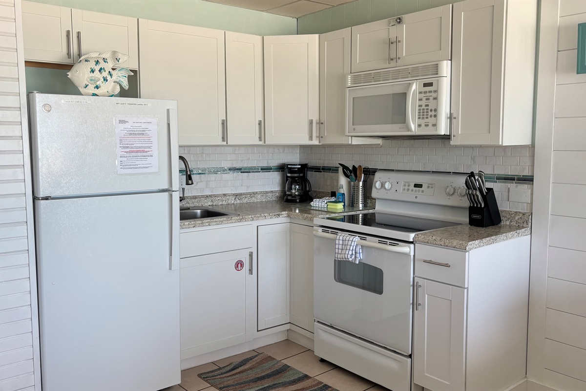 Full kitchen with dishes, pots, pans to cook meals if you desire.