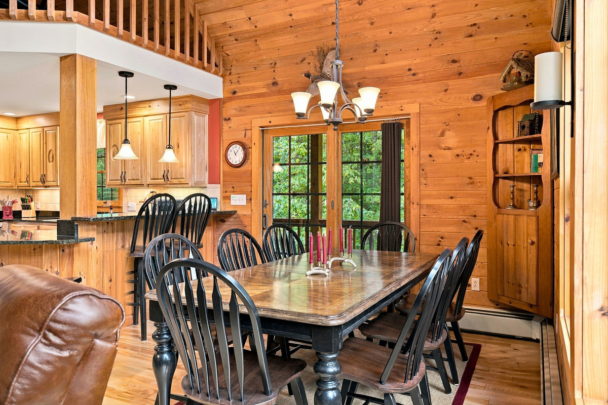 The dining area opens directly to the deck for easy indoor-outdoor living.