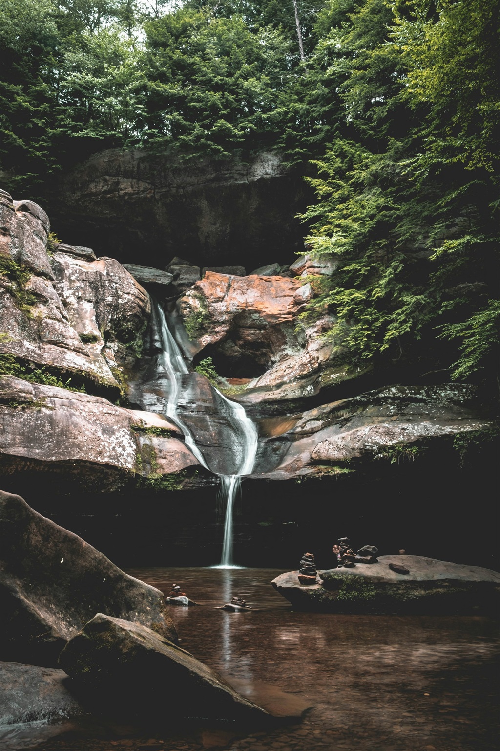 Hocking Hills gorge waterfall in March surrounded by rocks and forest