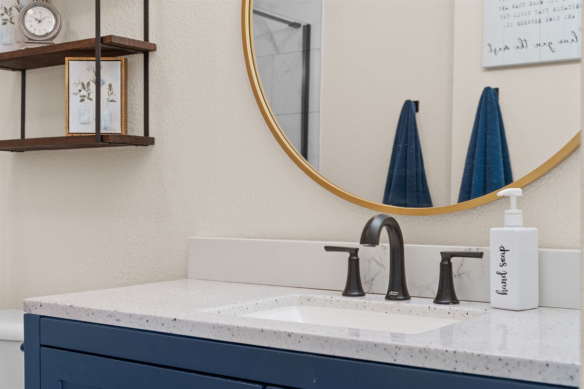 Updated vanity with quartz counters.